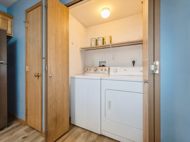 5908 Sutton Pl Unit 1, Urbandale, IA 50322 - laundry area with washing machine and clothes dryer and light wood finished floors