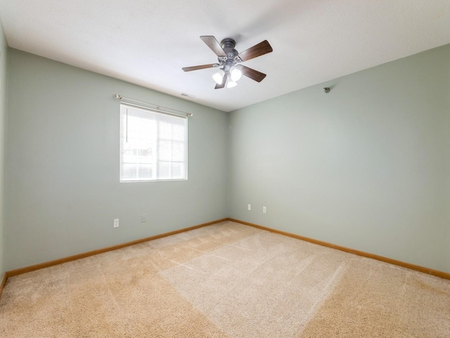 5908 Sutton Pl Unit 1, Urbandale, IA 50322 - spare room featuring light colored carpet and a ceiling fan