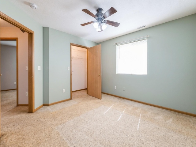 5908 Sutton Pl Unit 1, Urbandale, IA 50322 - unfurnished bedroom featuring carpet, a closet, and a ceiling fan