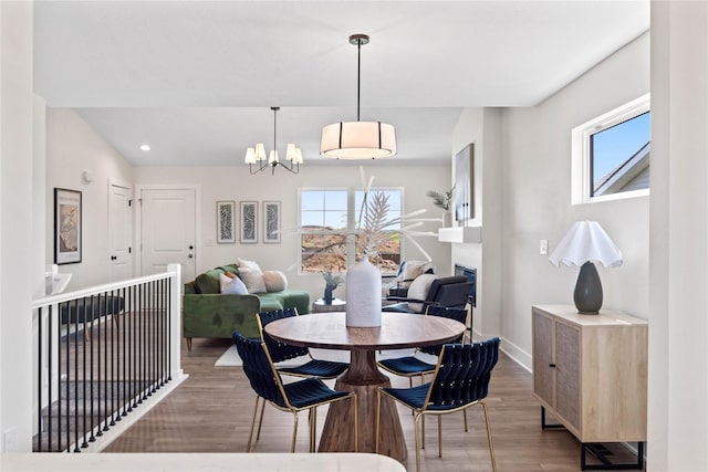 305 S Valley View Dr, Norwalk, IA 50211 - dining area with a chandelier, wood finished floors, and recessed lighting