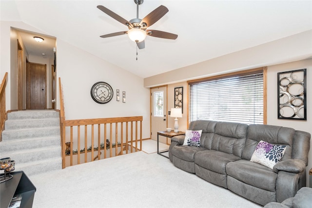 530 N 9th St, Carlisle, IA 50047 - carpeted living area featuring vaulted ceiling, ceiling fan, and stairs