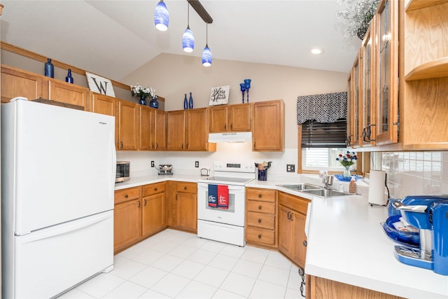 530 N 9th St, Carlisle, IA 50047 - kitchen with white appliances, under cabinet range hood, lofted ceiling, light countertops, and decorative light fixtures
