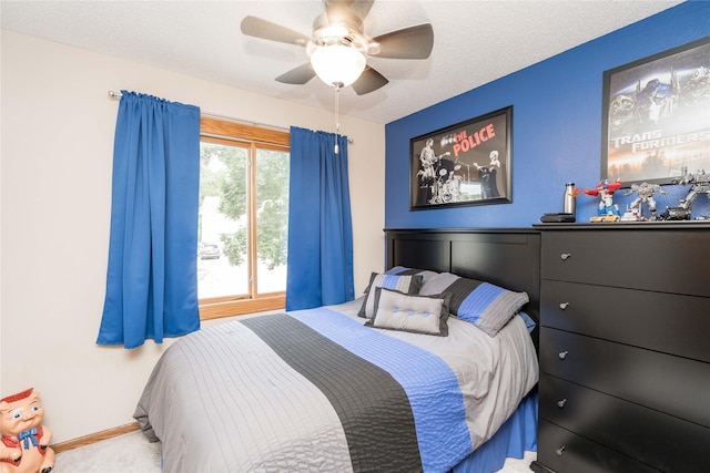 530 N 9th St, Carlisle, IA 50047 - carpeted bedroom featuring ceiling fan and a textured ceiling