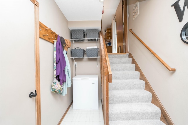 530 N 9th St, Carlisle, IA 50047 - staircase featuring tile patterned floors and baseboards