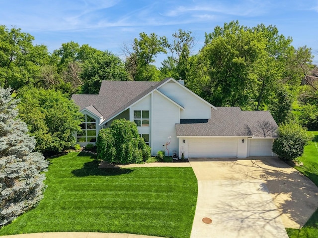4709 Colt Dr, West Des Moines, IA 50265 - mid-century modern home featuring a garage, concrete driveway, a front lawn, view of scattered trees, and a shingled roof