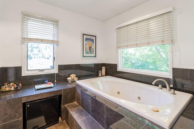 4709 Colt Dr, West Des Moines, IA 50265 - bathroom with plenty of natural light and a tub with jets