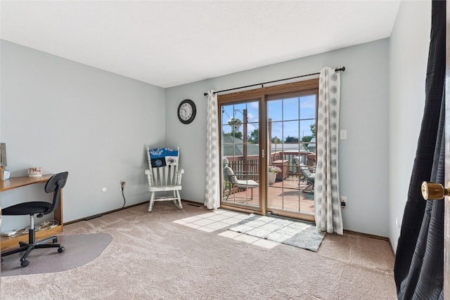 206 Main St, Grinnell, IA 50112 - carpeted home office featuring baseboards