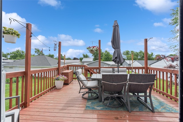 206 Main St, Grinnell, IA 50112 - wooden terrace with outdoor dining space