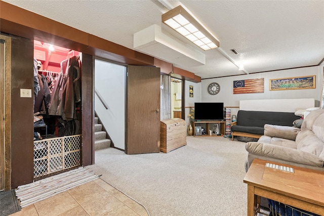 206 Main St, Grinnell, IA 50112 - carpeted living area with a textured ceiling and stairway