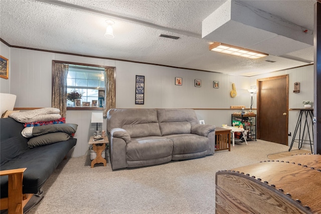206 Main St, Grinnell, IA 50112 - living room featuring carpet, crown molding, and a textured ceiling