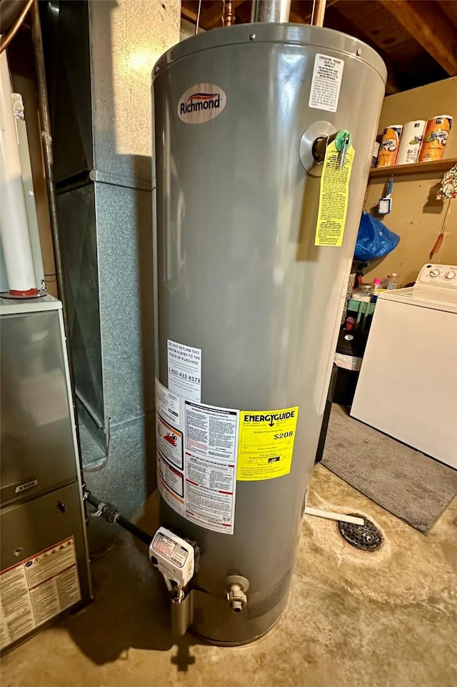 206 Main St, Grinnell, IA 50112 - utility room featuring water heater, washer / dryer, and heating unit