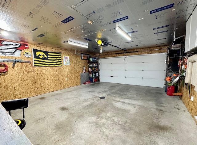 206 Main St, Grinnell, IA 50112 - garage featuring a garage door opener