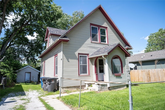 2015 Mondamin Ave, Des Moines, IA 50311 - view of front of house featuring roof with shingles and an outbuilding