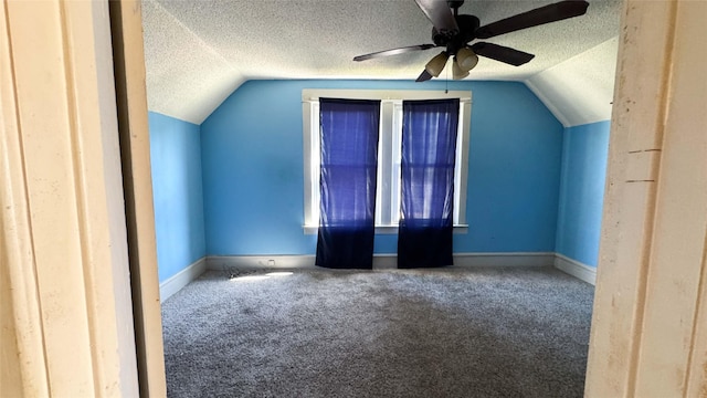 2015 Mondamin Ave, Des Moines, IA 50311 - additional living space with lofted ceiling, carpet flooring, a textured ceiling, and a ceiling fan