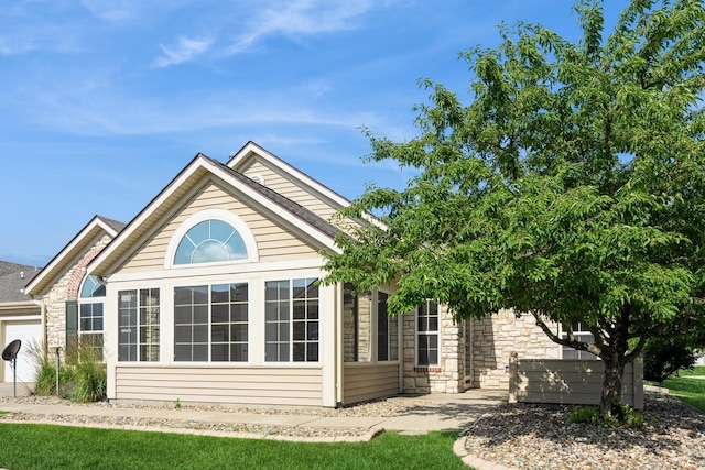 3305 SE Glenstone Dr Unit 172, Grimes, IA 50111 - view of property exterior with stone siding