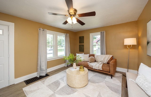 221 9th St, West Des Moines, IA 50265 - living area featuring ceiling fan and wood finished floors
