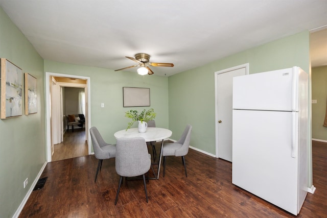 221 9th St, West Des Moines, IA 50265 - dining room with wood finished floors and ceiling fan