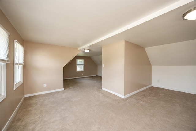 221 9th St, West Des Moines, IA 50265 - additional living space with light colored carpet and lofted ceiling