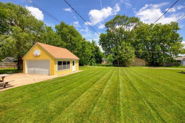 221 9th St, West Des Moines, IA 50265 - view of yard featuring an outbuilding and a garage