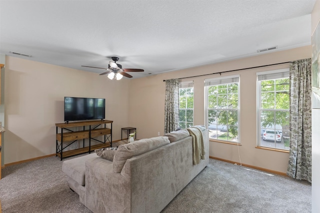 8302 Westown Pkwy Unit 8110, West Des Moines, IA 50266 - living area featuring healthy amount of natural light, carpet, and a ceiling fan