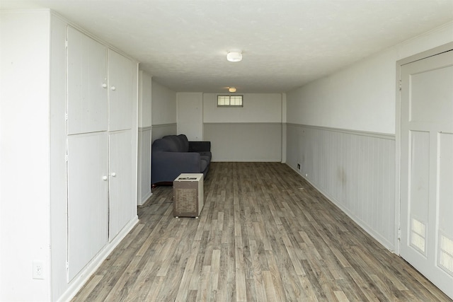 832 E Lacona Ave, Des Moines, IA 50315 - unfurnished room with light wood finished floors and a wainscoted wall