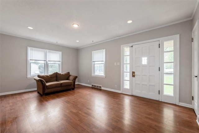 1250 NE 52nd Ave, Des Moines, IA 50313 - foyer entrance with crown molding, dark wood-type flooring, and recessed lighting