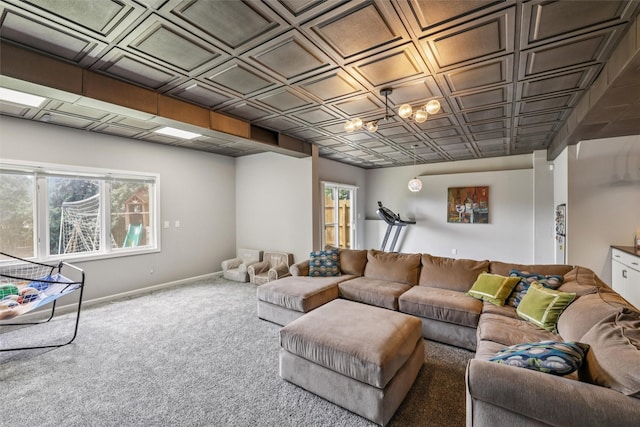 14638 Woodcrest Dr, Clive, IA 50325 - carpeted living room with baseboards and an ornate ceiling