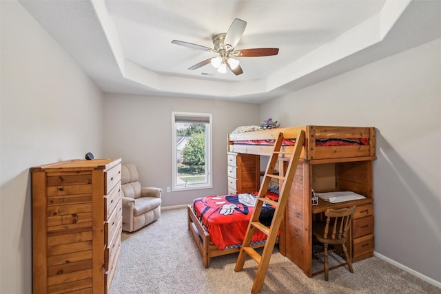 14638 Woodcrest Dr, Clive, IA 50325 - carpeted bedroom with a raised ceiling and a ceiling fan