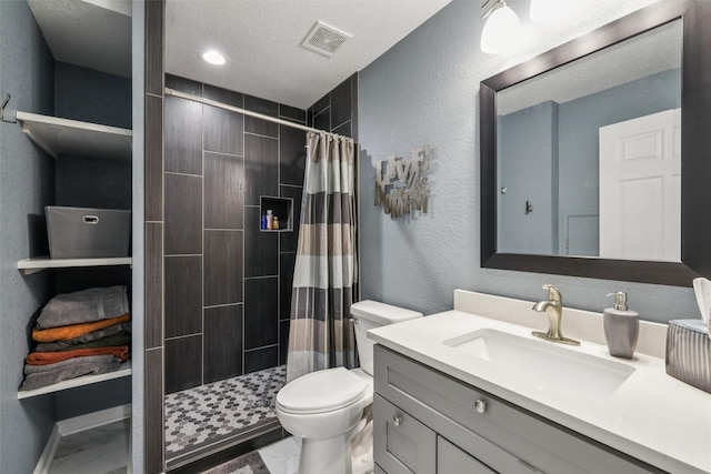 14638 Woodcrest Dr, Clive, IA 50325 - bathroom with vanity, tiled shower, and marble finish flooring