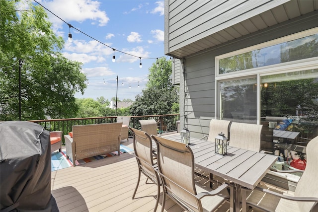 14638 Woodcrest Dr, Clive, IA 50325 - wooden deck with outdoor dining area, an outdoor living space, and area for grilling