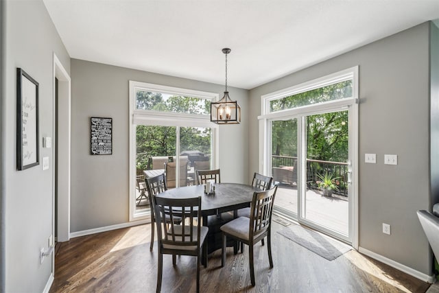 14638 Woodcrest Dr, Clive, IA 50325 - dining area featuring a chandelier and wood finished floors