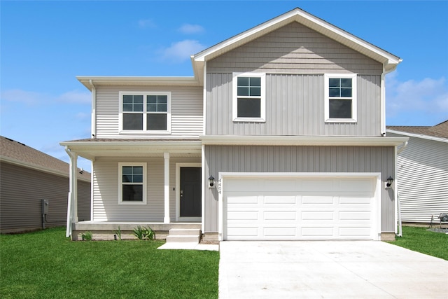 4404 NE 16th St, Ankeny, IA 50021 - view of front facade featuring covered porch, a garage, a front yard, and driveway