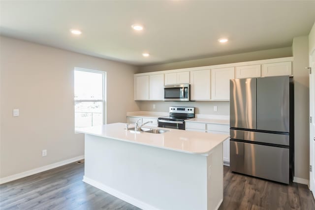 4404 NE 16th St, Ankeny, IA 50021 - kitchen featuring appliances with stainless steel finishes, light countertops, white cabinetry, dark wood finished floors, and recessed lighting