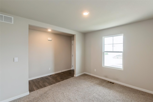 4404 NE 16th St, Ankeny, IA 50021 - empty room featuring dark carpet and recessed lighting