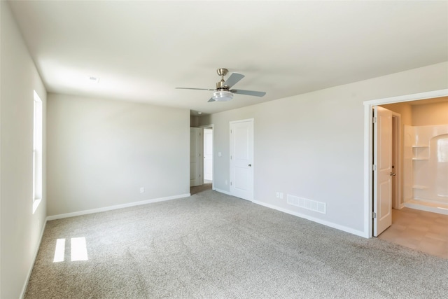 4404 NE 16th St, Ankeny, IA 50021 - unfurnished bedroom featuring light carpet, multiple windows, and a ceiling fan