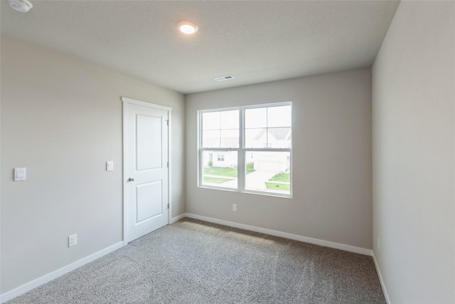 4404 NE 16th St, Ankeny, IA 50021 - carpeted empty room featuring baseboards and a smoke detector