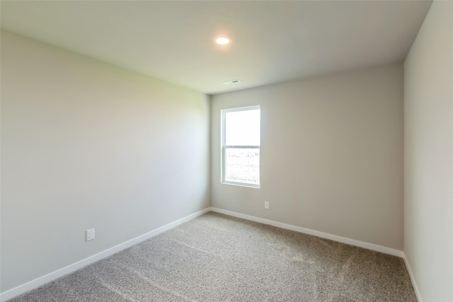 4404 NE 16th St, Ankeny, IA 50021 - unfurnished room featuring light carpet and recessed lighting