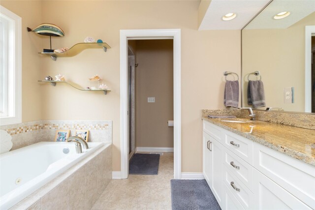 862 Glen Oaks Ter, West Des Moines, IA 50266 - full bathroom with vanity, a tub with jets, a shower stall, and tile patterned floors