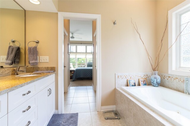 862 Glen Oaks Ter, West Des Moines, IA 50266 - ensuite bathroom with vanity, a bath, tile patterned flooring, and a ceiling fan