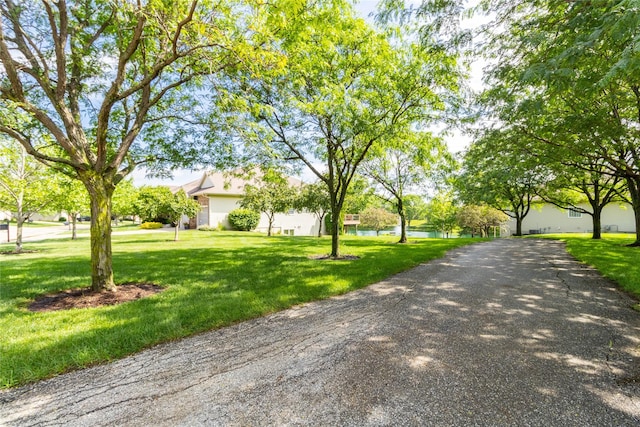 862 Glen Oaks Ter, West Des Moines, IA 50266 - view of front of property with a front yard and a water view