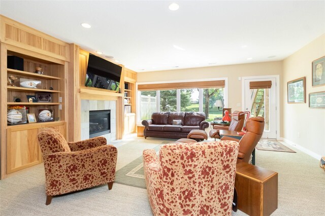 862 Glen Oaks Ter, West Des Moines, IA 50266 - living area with light colored carpet, recessed lighting, a glass covered fireplace, and built in features