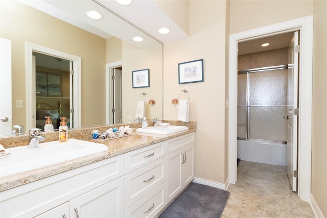 862 Glen Oaks Ter, West Des Moines, IA 50266 - bathroom featuring double vanity, enclosed tub / shower combo, and recessed lighting