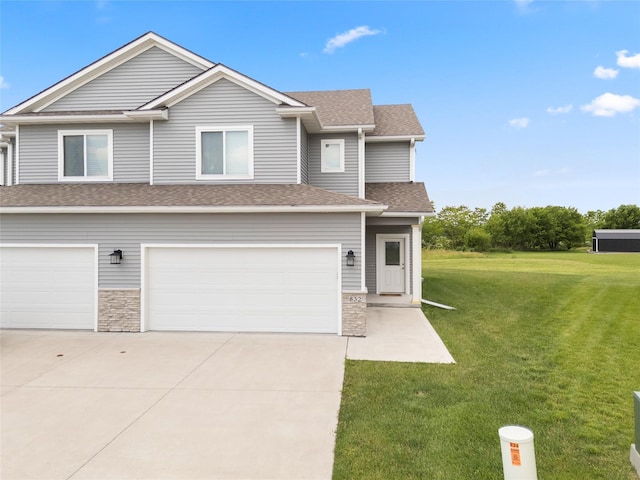 832 Kinney Cir NE, Bondurant, IA 50035 - view of front of house featuring a garage, a front lawn, roof with shingles, and driveway