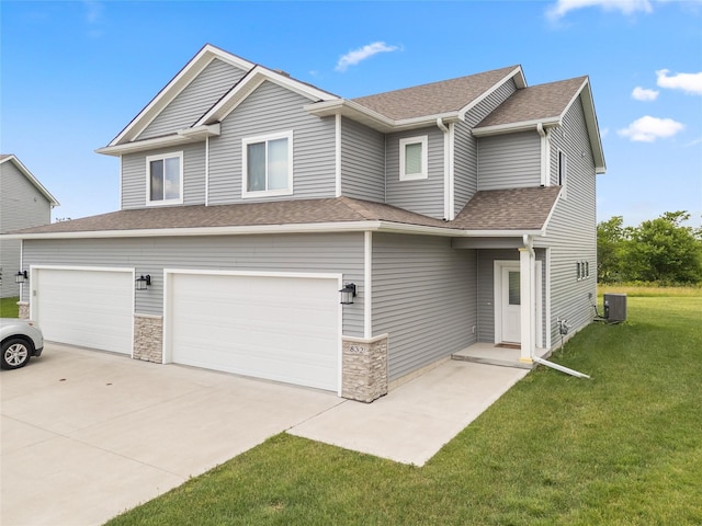 832 Kinney Cir NE, Bondurant, IA 50035 - view of front of home with a front lawn, driveway, a garage, a shingled roof, and stone siding