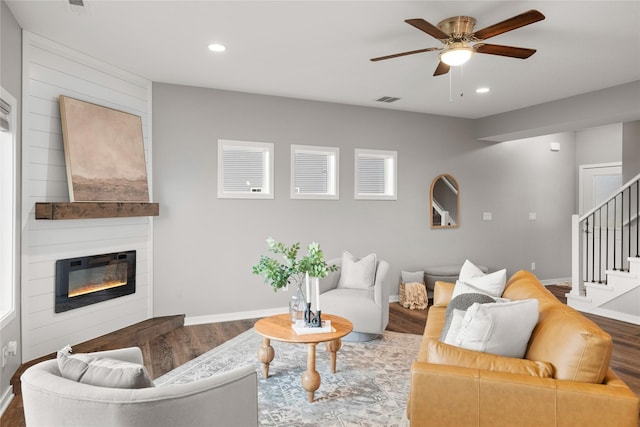 832 Kinney Cir NE, Bondurant, IA 50035 - living area with wood finished floors, recessed lighting, ceiling fan, stairway, and a large fireplace