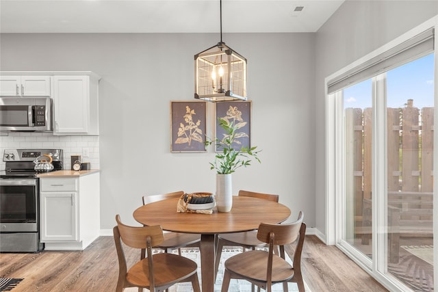 832 Kinney Cir NE, Bondurant, IA 50035 - dining room featuring light wood finished floors and baseboards