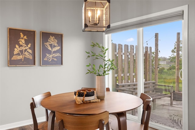 832 Kinney Cir NE, Bondurant, IA 50035 - dining room featuring a chandelier, healthy amount of natural light, and wood finished floors