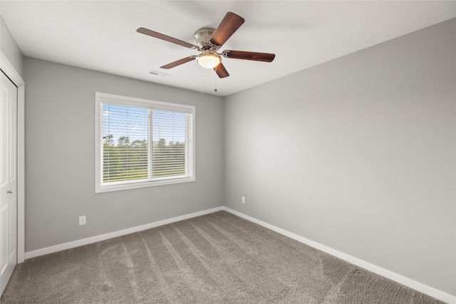 832 Kinney Cir NE, Bondurant, IA 50035 - spare room with carpet flooring and a ceiling fan