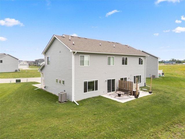 832 Kinney Cir NE, Bondurant, IA 50035 - back of property with a patio area, a yard, and a shingled roof
