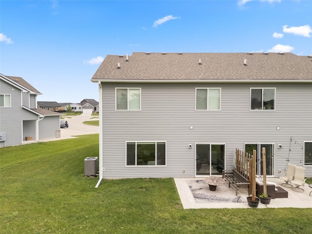 832 Kinney Cir NE, Bondurant, IA 50035 - rear view of house featuring a patio, a yard, and roof with shingles